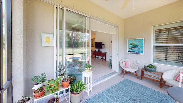 sunroom with plenty of natural light and ceiling fan