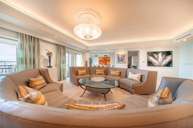 living room featuring a raised ceiling