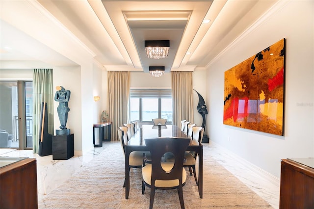 dining area with a chandelier and crown molding