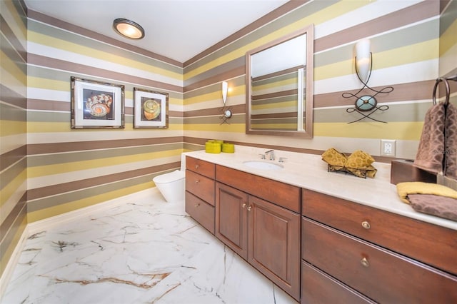 bathroom featuring vanity and toilet