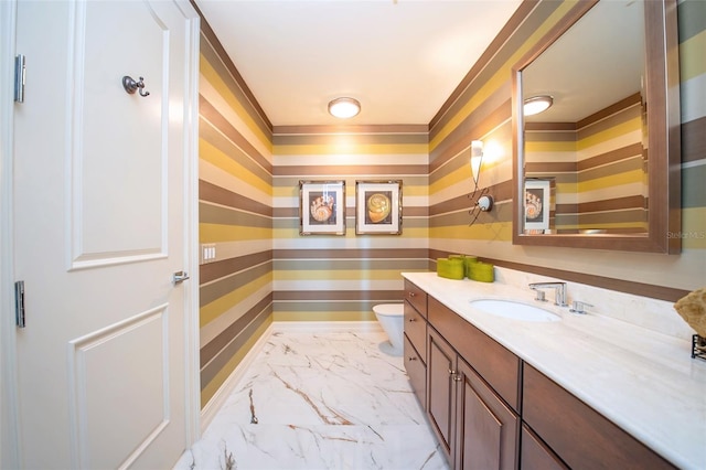 bathroom with vanity and toilet