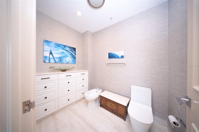 bathroom featuring a bidet and toilet