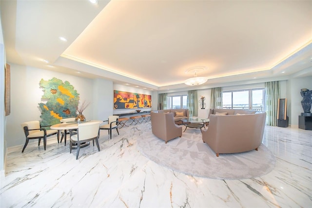 living room featuring a tray ceiling