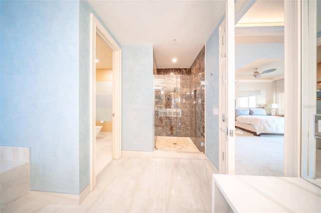 bathroom featuring ceiling fan, toilet, and walk in shower