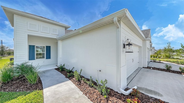 view of property exterior with a garage