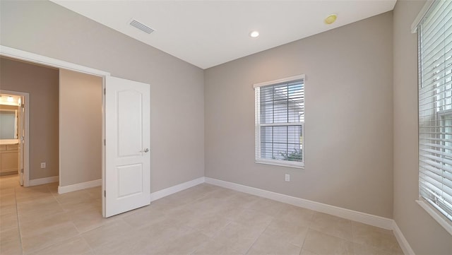 interior space with a healthy amount of sunlight and light tile patterned floors