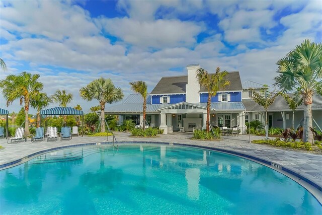 view of swimming pool with a patio area