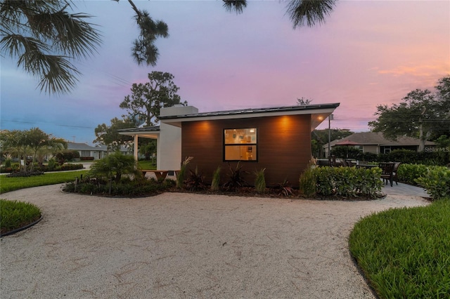 view of property exterior at dusk