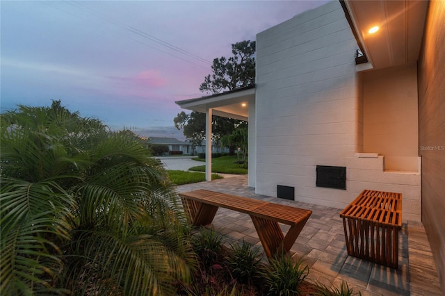 view of patio terrace at dusk