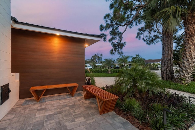 view of patio terrace at dusk