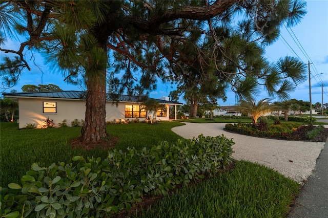 view of front of home with a front lawn