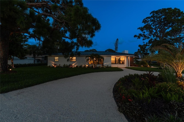 ranch-style home with a front yard