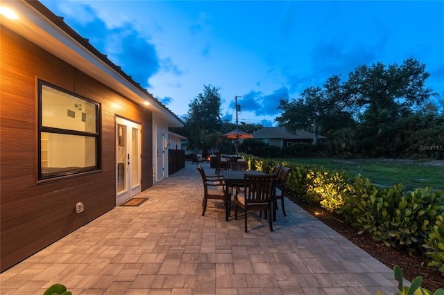 view of patio terrace at dusk