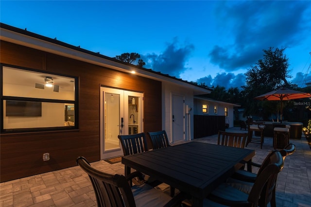 view of patio terrace at dusk