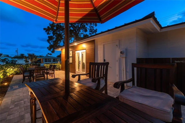 deck at dusk with a patio