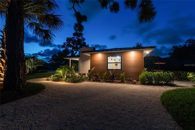 view of property exterior at dusk