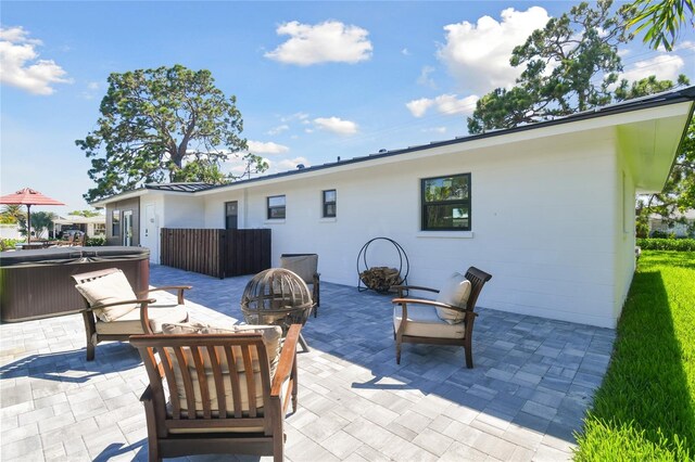 view of patio with an outdoor fire pit