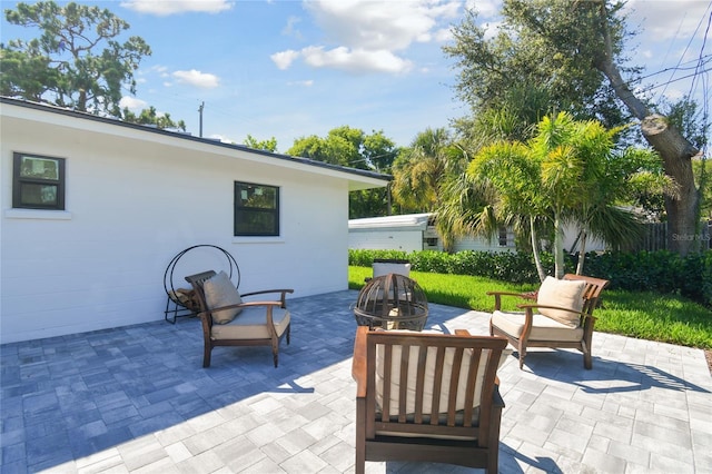 view of patio featuring an outdoor fire pit