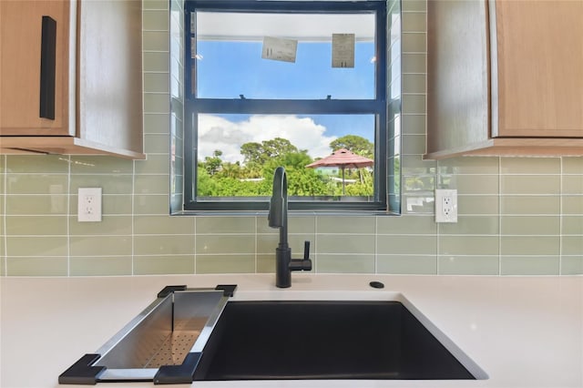 kitchen featuring sink and backsplash