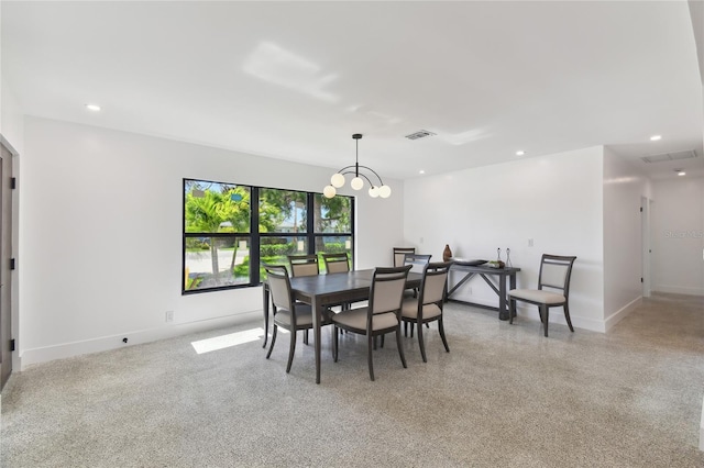 dining room with a notable chandelier