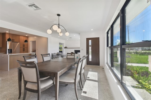 dining space featuring a chandelier