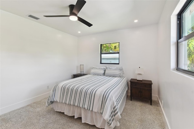 carpeted bedroom featuring ceiling fan