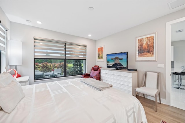 bedroom with light wood-type flooring