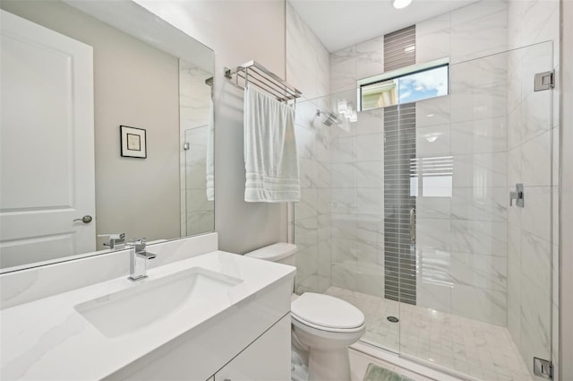 bathroom with toilet, a shower with door, and vanity