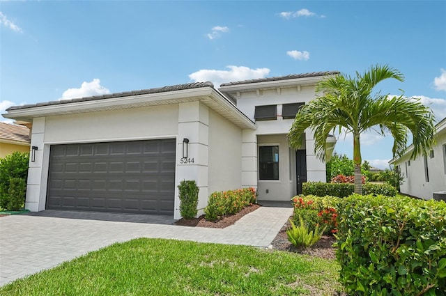 view of front of property with a garage