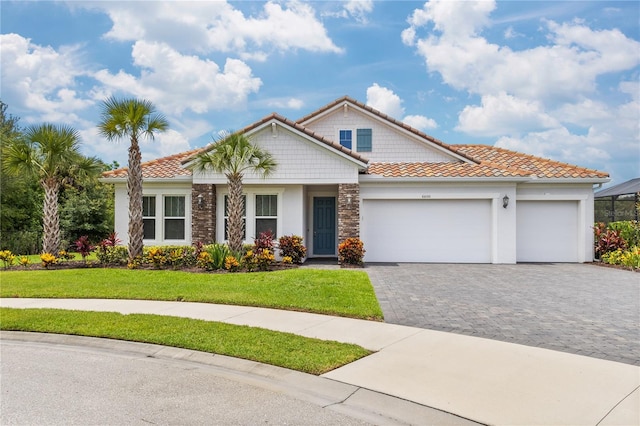 view of front of house with a garage and a front yard