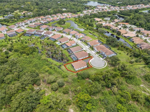 drone / aerial view with a water view