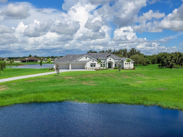 ranch-style home featuring a water view and a front lawn