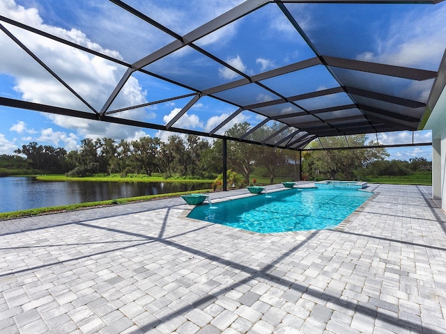 view of pool featuring a lanai, a patio area, and a water view