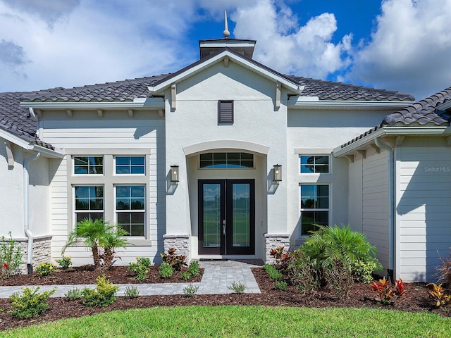 entrance to property featuring french doors