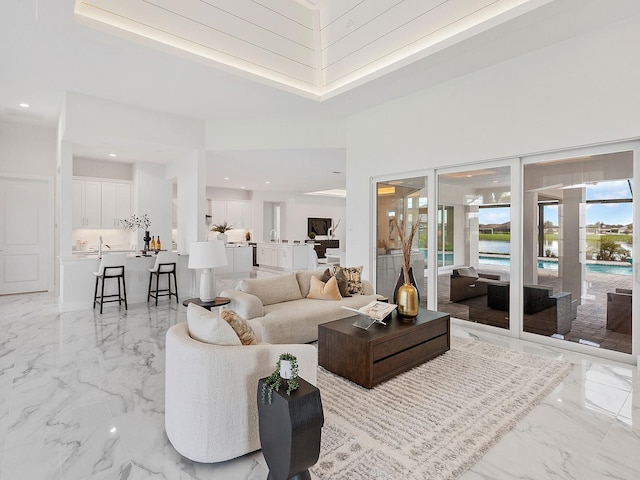 living room featuring a towering ceiling