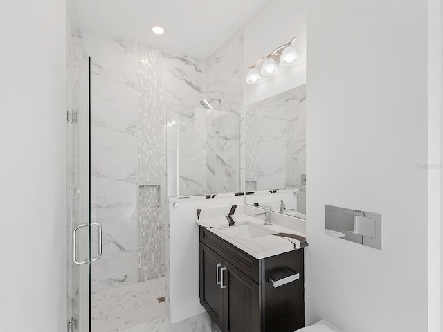 bathroom with vanity and an enclosed shower