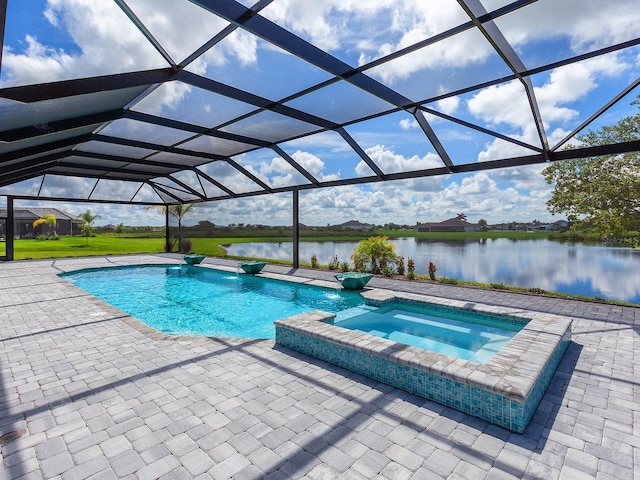 view of pool featuring a lanai, pool water feature, an in ground hot tub, a water view, and a patio