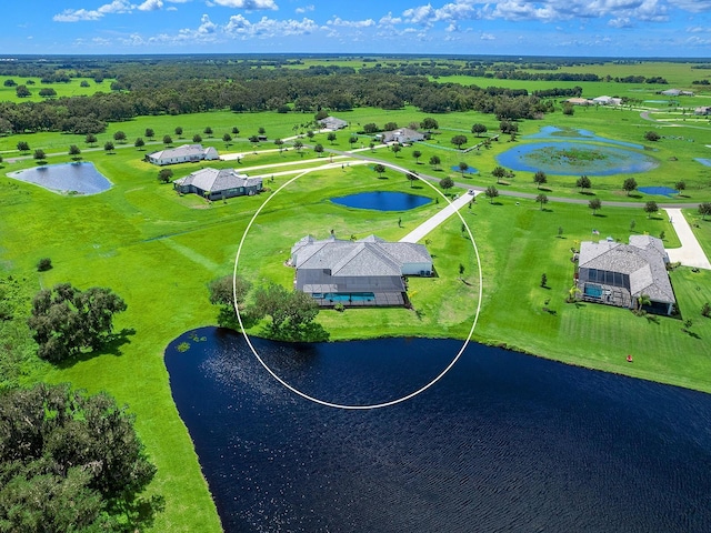 birds eye view of property with a water view