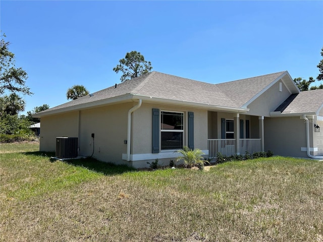 view of home's exterior with a porch, stucco siding, a shingled roof, cooling unit, and a lawn