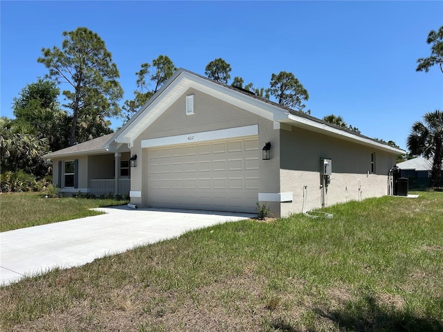 view of front of property featuring a front yard, stucco siding, driveway, and an attached garage