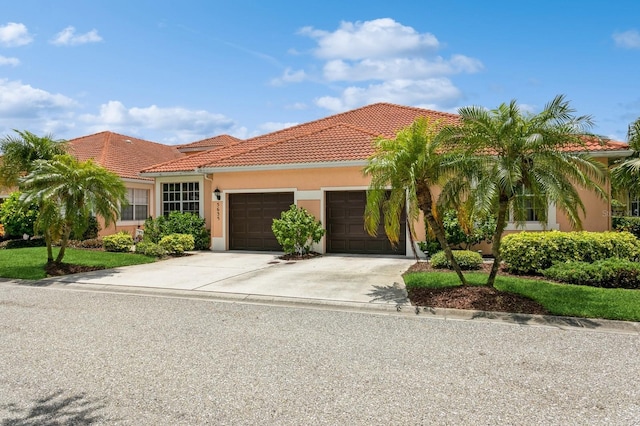 mediterranean / spanish house featuring a garage