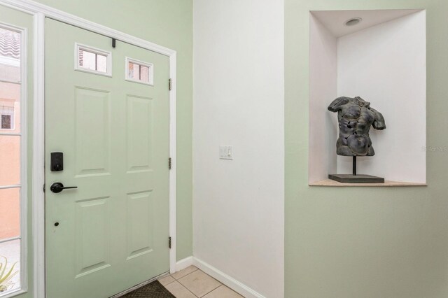 foyer with light tile patterned flooring