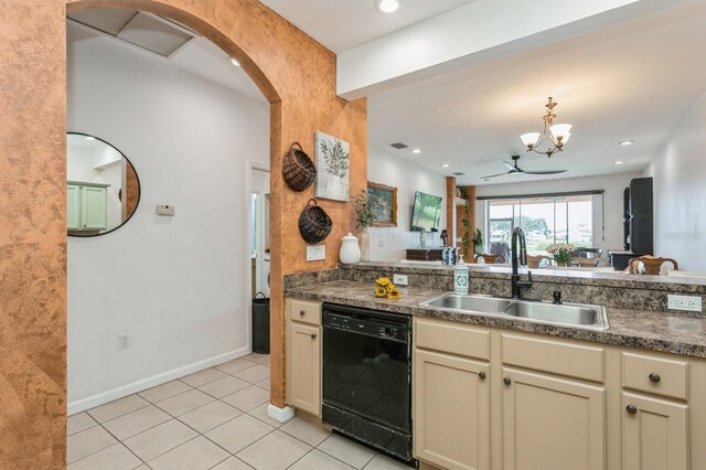 kitchen featuring sink, black dishwasher, cream cabinetry, and light tile patterned floors