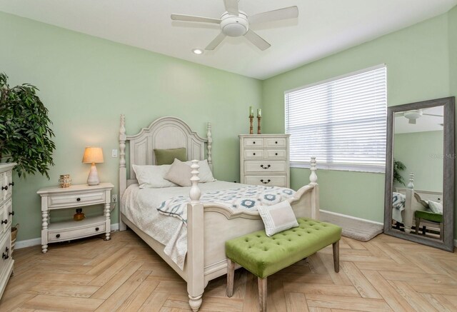 bedroom with light parquet floors and ceiling fan