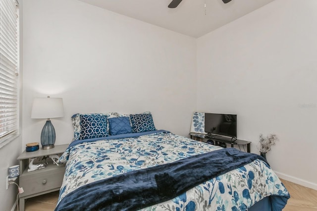 bedroom with light parquet floors and ceiling fan