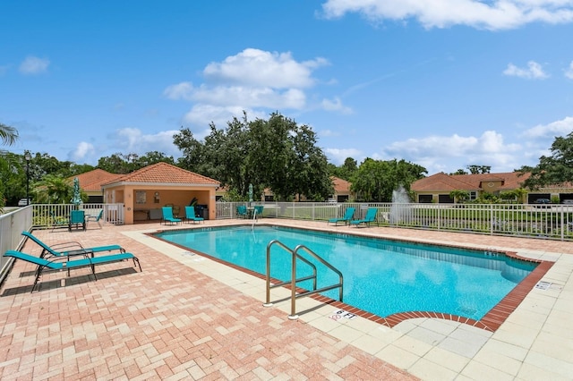 view of swimming pool with a patio area