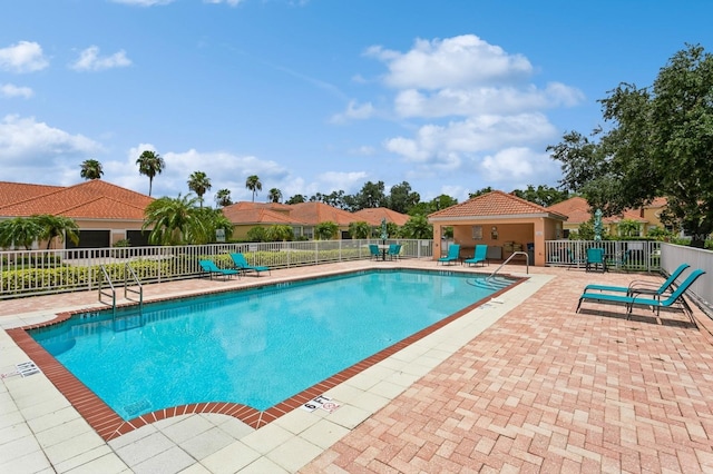 view of swimming pool featuring a patio area