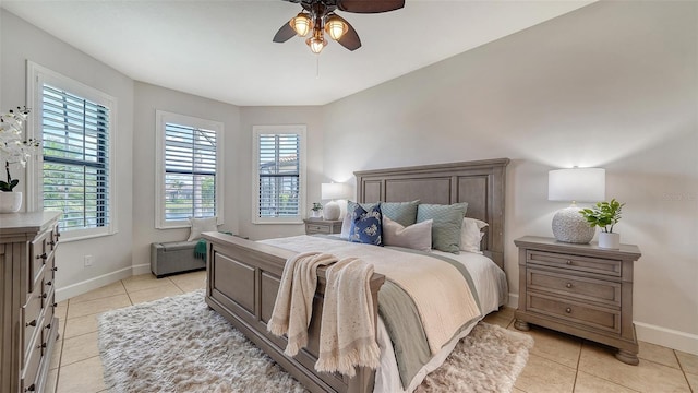 bedroom featuring ceiling fan and light tile patterned floors