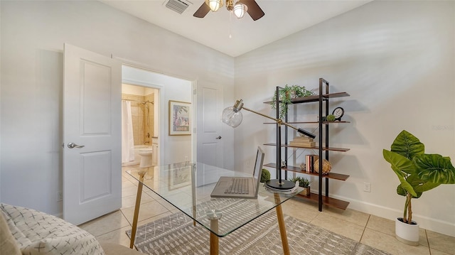 office space featuring ceiling fan and light tile patterned flooring