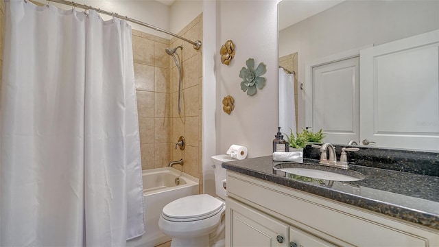 full bathroom featuring shower / tub combo with curtain, vanity, and toilet